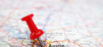 Picture of a map with a pinpoint on Austin, Texas.