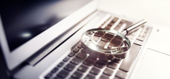 magnifying glass on laptop