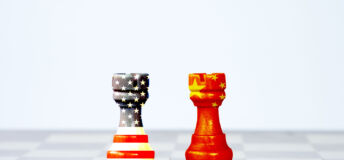 USA flag and China flag print screen on chess with white background.It is symbol of tariff trade war tax barrier between United States of America and China.-Image.