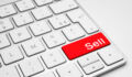 Red Sell button on a white keyboard isolated on a white background