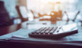 Summit Peak Ventures closes on $58.6m for Fund IV, targeting $150m Close up calculator on business working desk, dark background.