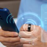 Smart ring and smart phone photo illustration.