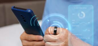 Smart ring and smart phone photo illustration.